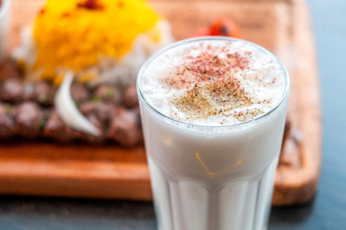 Glass of doogh yogurt drink with mint