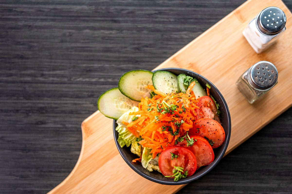 Garden salad with lettuce, cucumber, tomato and carrot