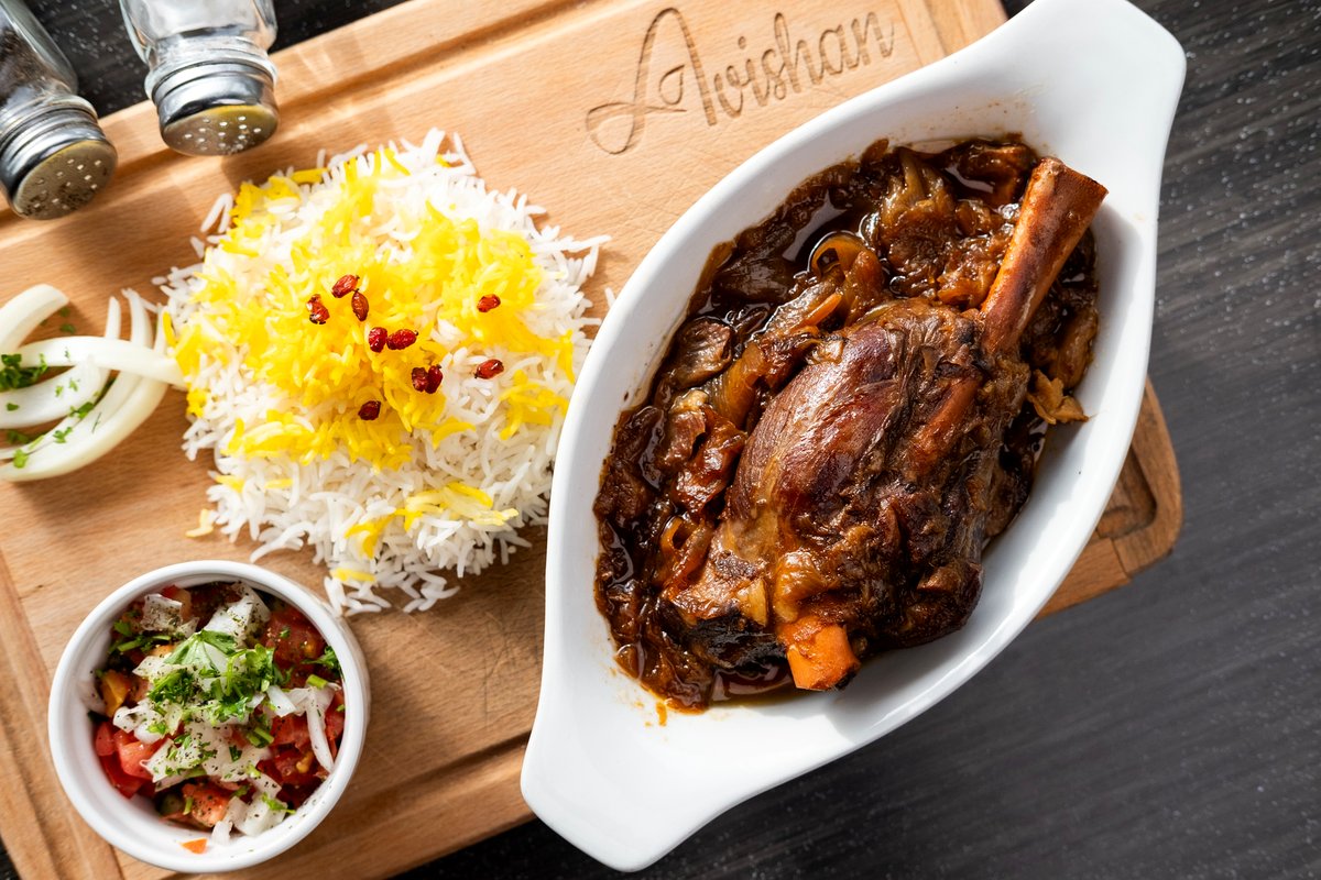 Slow roasted lamb shank with saffron rice and salad