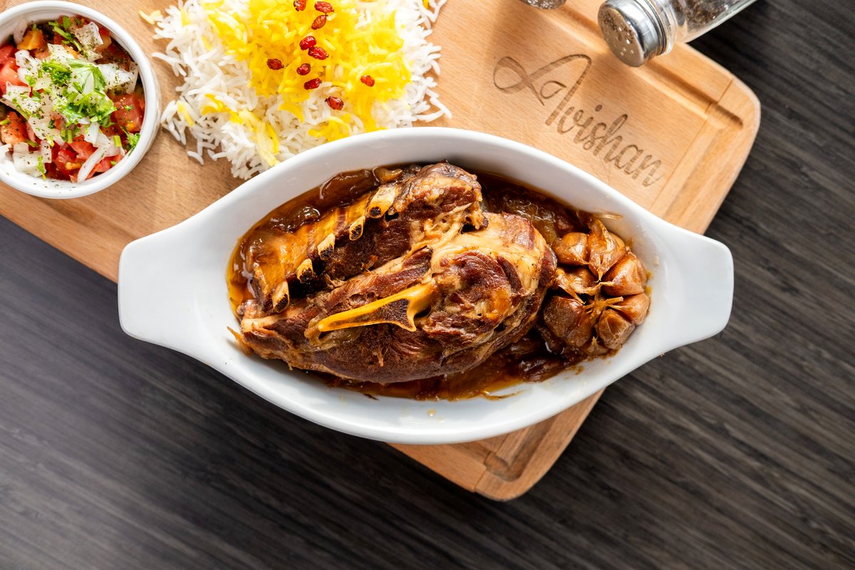 Slow roasted lamb shoulder with saffron rice and salad